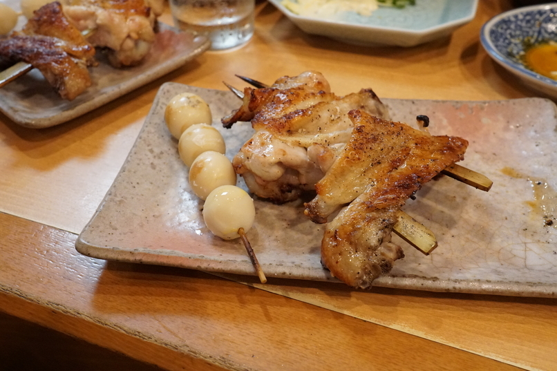 Crispy thigh and smoky quail eggs skewers